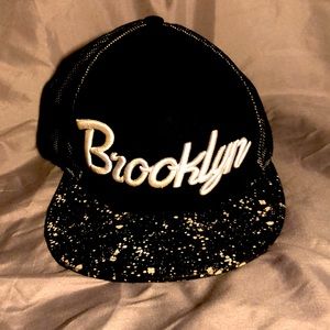 A flat rim snap back hat